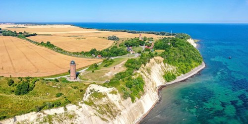 Aerial view of Cape Arkona on the island of Ruegen at the Baltic Sea with lighthouse and chalk cliff panorama in Cape Arkona