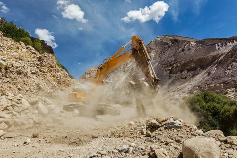 Excavator doing road construction in Himalayas. Ladakh