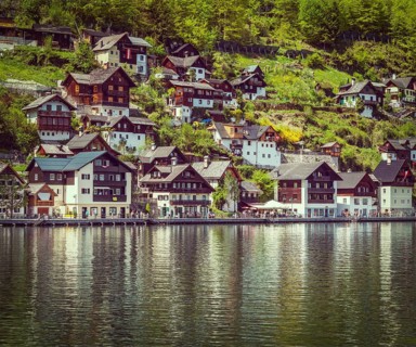 Vintage retro effect filtered hipster style travel image of Austrian tourist destination Hallstatt village on Hallstatter See in Austrian alps. Salzkammergut region