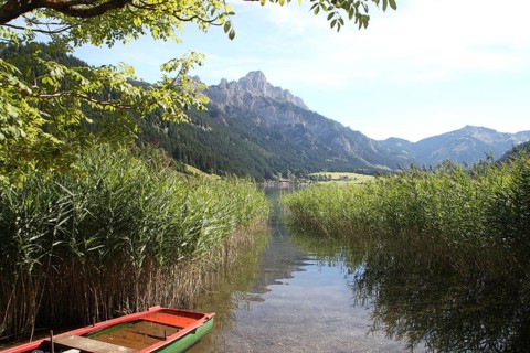 Haldensee with view of Gimpel and Rote Flueh in the Tannheim Valley