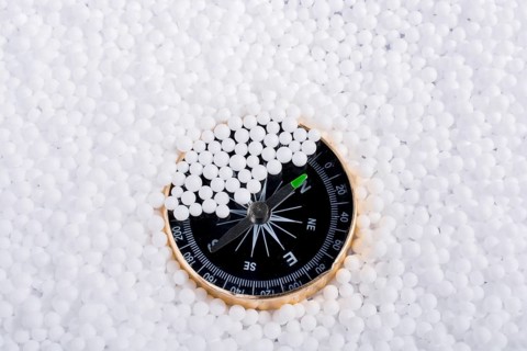 Compass on little white polystyrene foam balls