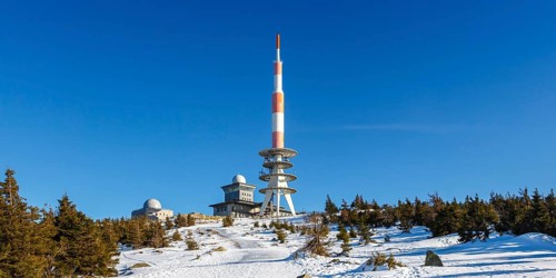 Summit of the mountain Brocken in the Harz with snow in winter Panorama at the Brocken