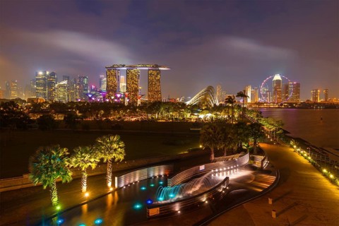 Tracel background of Singapore skyline illumintaed in the evening twilight