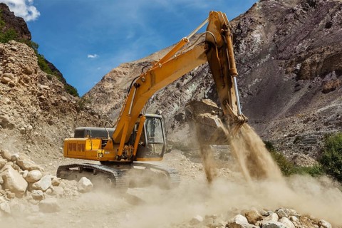 Excavator doing road construction in Himalayas. Ladakh