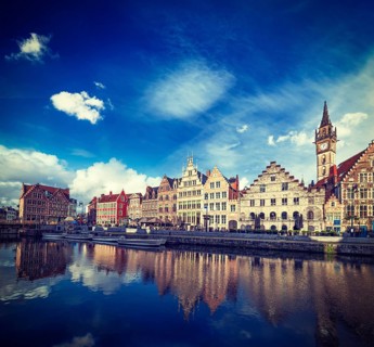 Vintage retro hipster style travel image of Europe Belgium medieval town travel background