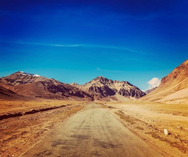 Vintage retro effect filtered hipster style travel image of Manali-Leh road to Ladakh in Indian Himalayas near Sarchu. Ladakh