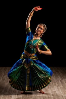 Young beautiful woman dancer exponent of Indian classical dance Bharatanatyam
