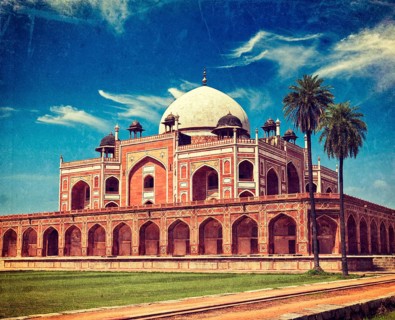 Vintage retro hipster style travel image of Humayun's Tomb with overlaid grunge texture. Delhi
