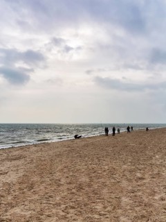 Strollers on the south beach in autumn