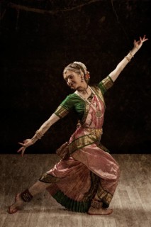 Vintage retro style image of young beautiful woman dancer exponent of Indian classical dance Bharatanatyam