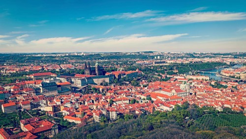 Vintage retro hipster style travel image of aerial panorama of Hradchany: the Saint Vitus
