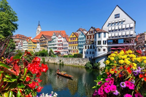 City on the Neckar River with punting boat in Tuebingen