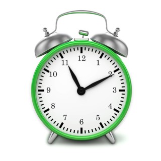 Green retro styled classic alarm clock isolated on white