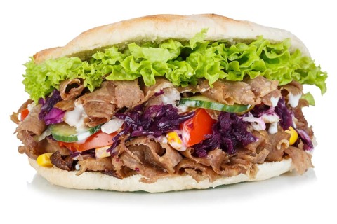 Doener Kebab Doner Kebap fast food in a flatbread cut out against a white background in Stuttgart