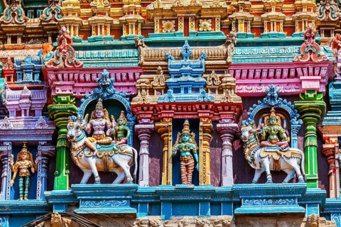 Shiva and Parvati on bull images. Sculptures on Hindu temple gopura tower. Meenakshi Temple