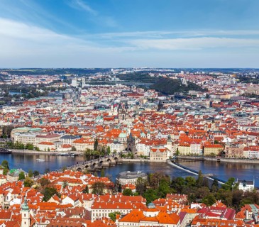 Aerial view of Charles Bridge over Vltava river and Old city from Petrin hill Observation Tower. Prague