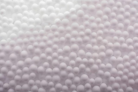 White little polystyrene foam balls as background