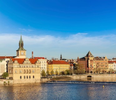 Prague Stare Mesto embankment view from Charles bridge on sunset. Prague