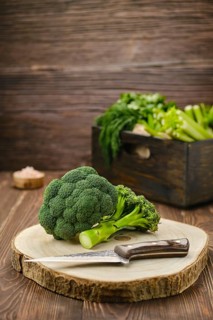 Fresh broccoli on wooden cutting board