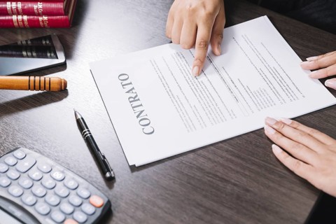 Woman pointing document near lady table with calculator smartphone pen. Resolution and high quality beautiful photo
