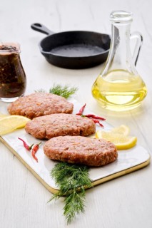 Uncooked cutlet with minced beef meat and cabbage ready for cooking