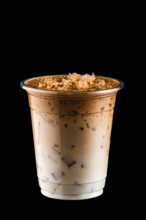 Coffee with ice in take away cup isolated on black background