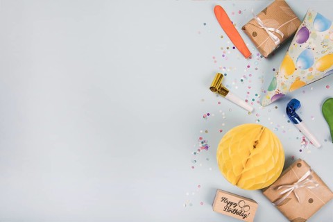 Overhead view party items gray background