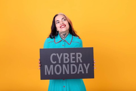 Beautiful woman holding a Cyber Monday sign. Commercial concept. Commerce