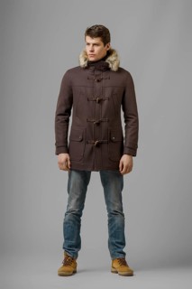 Full length portrait of handsome man in warm coat with hood posing in studio