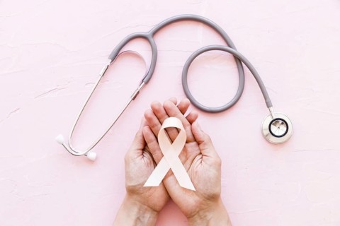 White awareness ribbon two hands with stethoscope pink background 1. Resolution and high quality beautiful photo