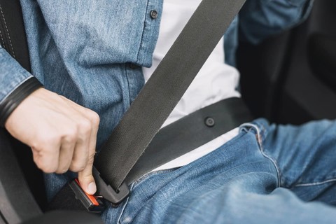Close up man putting safety belt