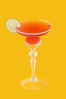 Cosmopolitan cocktail on yellow background