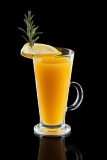 Glass of hot lemon tea with ginger and rosemary isoalted on black.