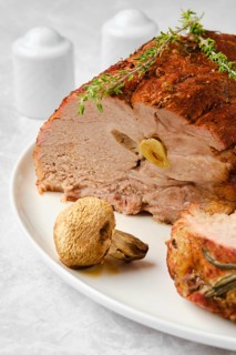 Pork neck baked in oven and cit on slice closeup