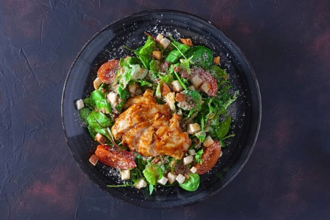 Fried turkey fillet with arugula