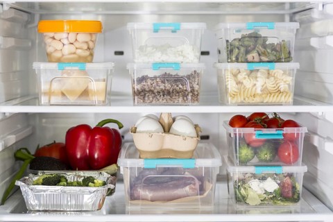 Open fridge with plastic food containers vegetables. Resolution and high quality beautiful photo