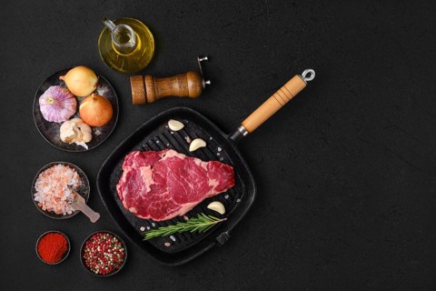 Overhead view of raw ribeye steak
