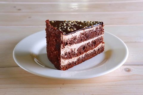 Layered chocolate cake. Biscuit dough with cream