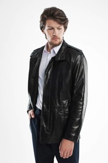 Brutal handsome unshaven man with beard and moustache in waterproof coat with fur collar