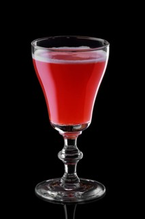 Glass of strawberry daiquiri cocktail isolated on black background background