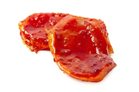 Raw piece of meat with spice and sauce prepered for barbecue. Gastronomy template isolated on white background