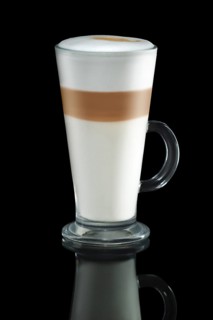 Glass of cappuccino with reflection isolated on black