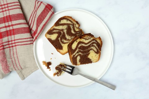 Two pieces of marble cake on plate