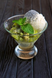 A cup of apple ice cream decorated with kiwi