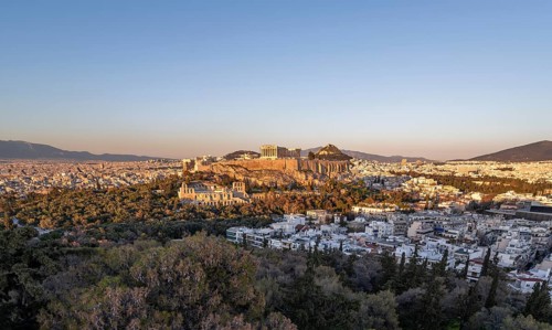 View from Philopappos Hill over the city at sunset