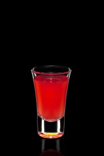 Fresh cranberry juice as ingredient for vodka cocktail isolated on black
