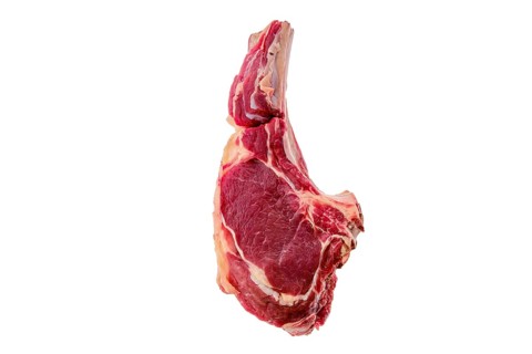 Beef ribeye steak bone-in isolated on white background