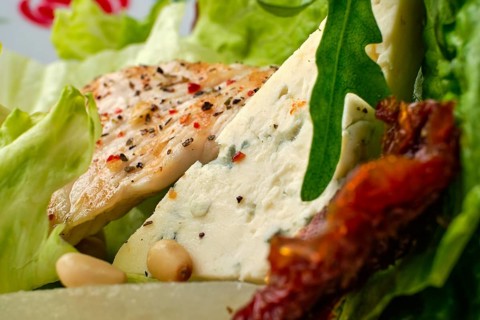 Macro photo of salad with roasted turkey