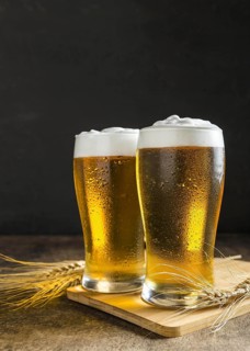 Front view glasses beer with wheat