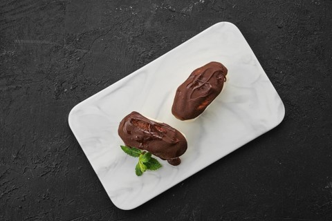 Top view of glazed curd with chocolate on marble plate